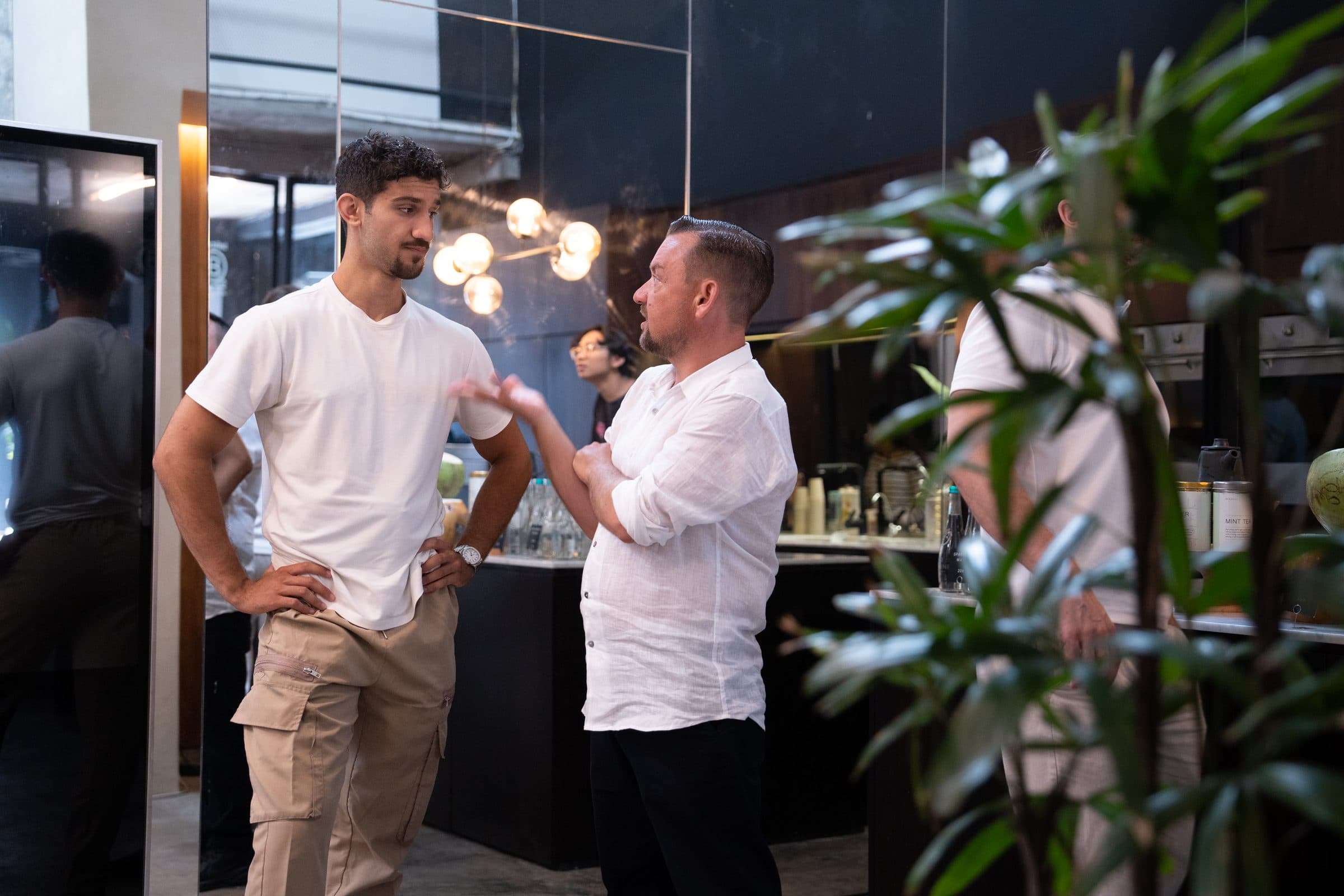 A conversation with a client at an evening event.