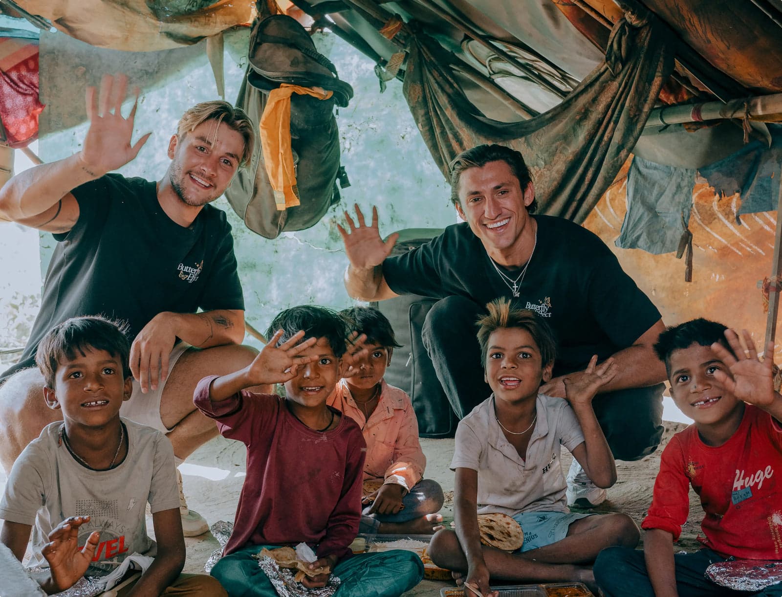 The Butterfly Effect team with children on a giving trip in Lima, Peru