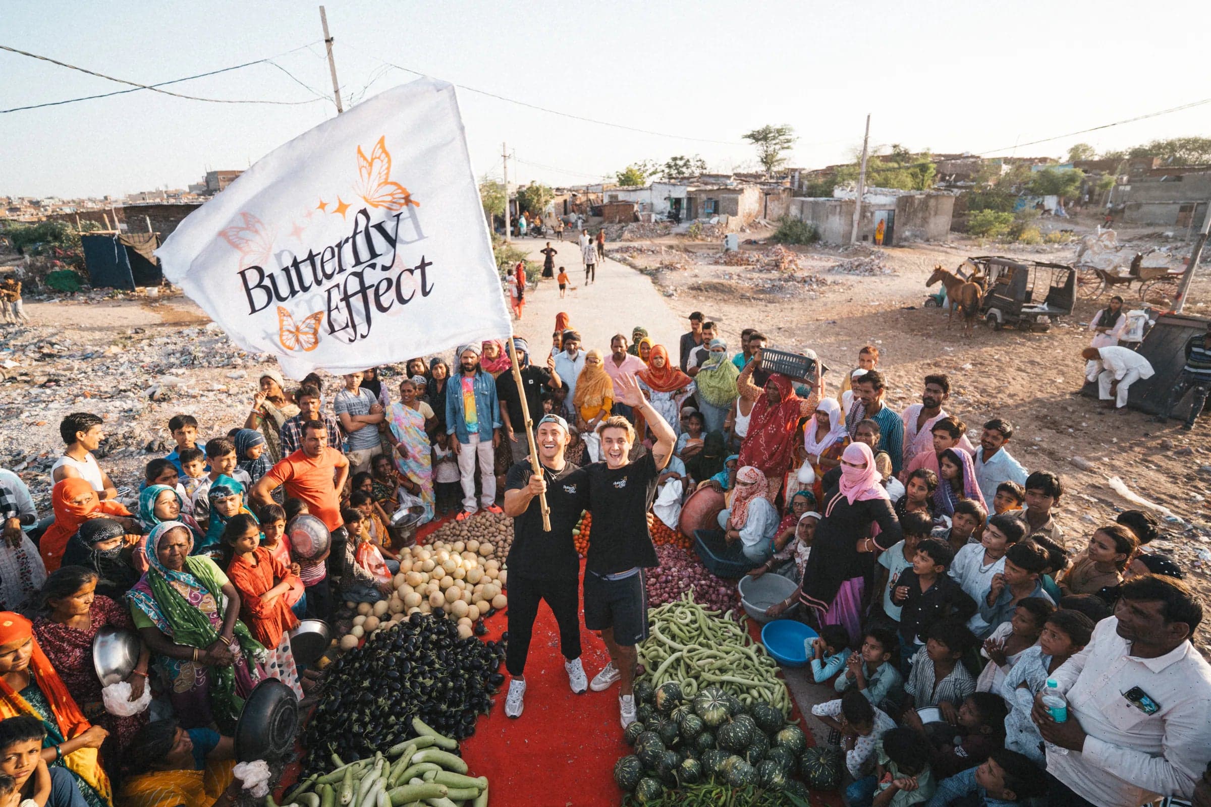 The Butterfly Effect team and community gathered under the brand's flag during a giving trip