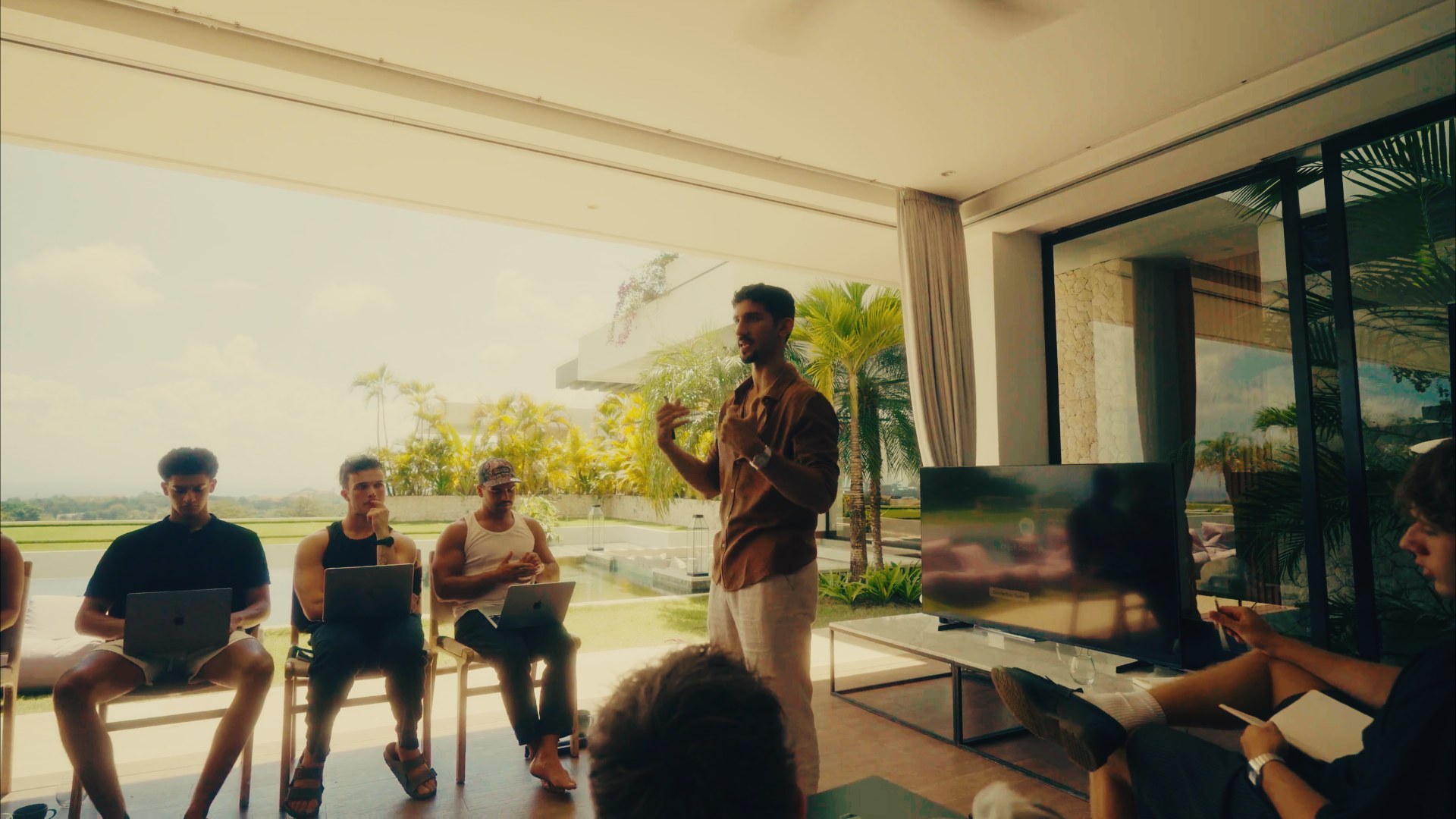 Alex presenting the AI Operating System framework to a room of operators at an Imperium mastermind