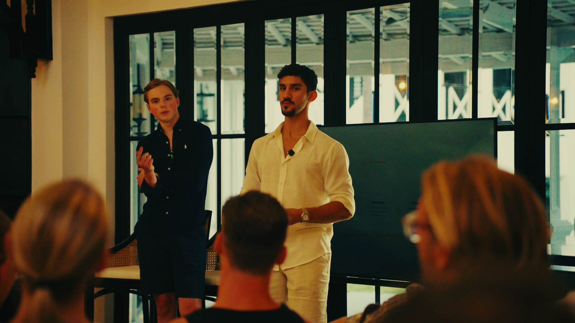 Alex and Archie presenting the operating system framework to a mastermind audience in Bali
